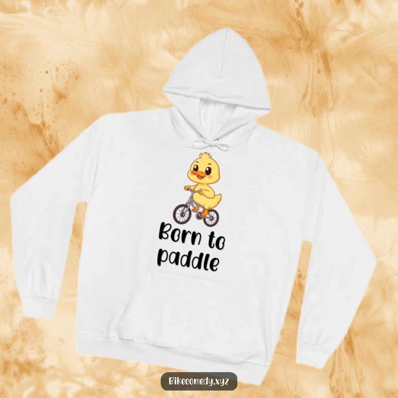 Funny duckling hoodie illustrated with a cheerful duckling focused on pedaling a small bicycle with unwavering determination.