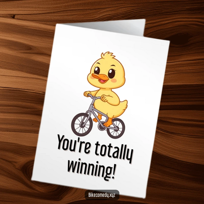 Funny Free Printable Congrats Card: A determined duckling pedals a bike, celebrating your wonderful success with a smile.