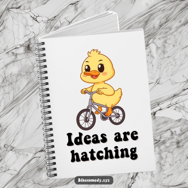 Funny duckling notebook cover shows a determined duckling focused on pedaling a small bicycle, inspiring note-taking and creative expression.